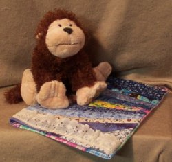 I'm getting sleepy so I'll get into my new Webkinz size quilt to snuggle!
